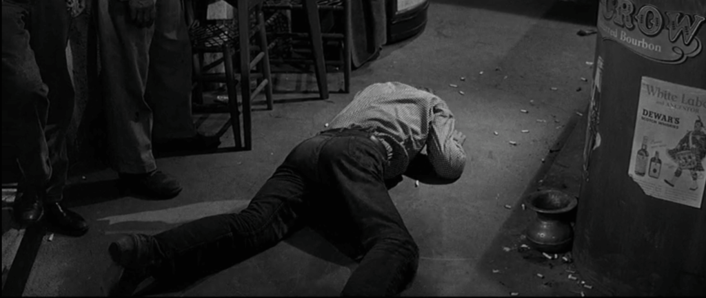 Kirk Douglas as Jack Burns in Lonely Are The Brave, lying on the ground